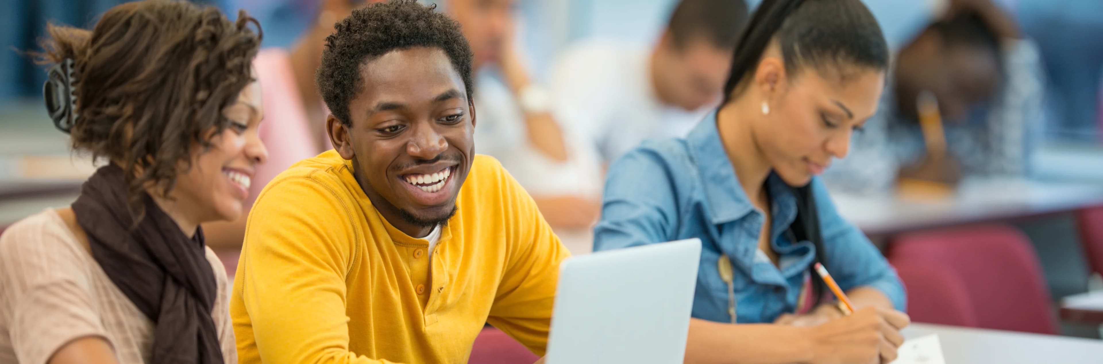 Students collaborating and studying together in a classroom